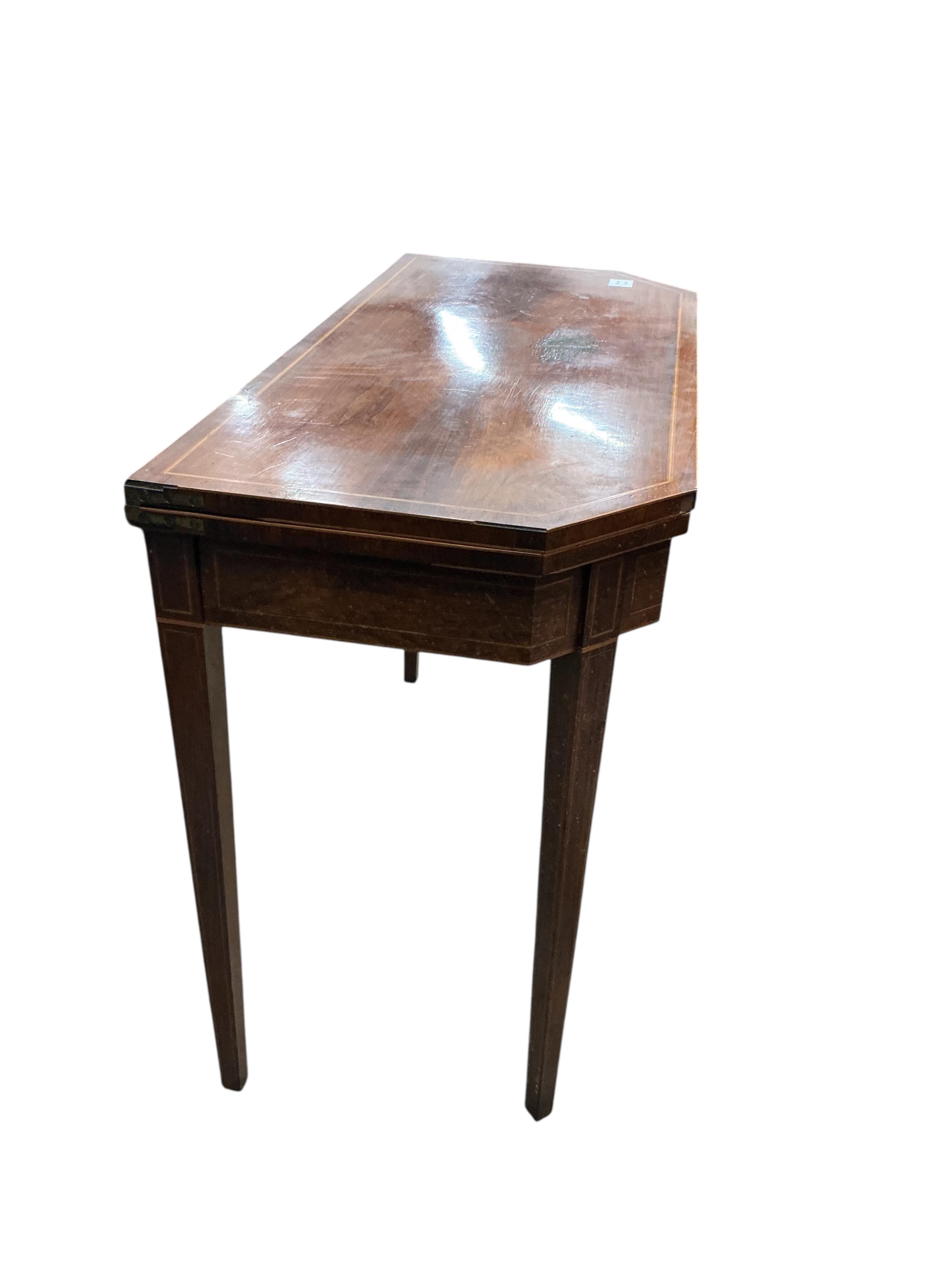 A George III inlaid banded rosewood folding tea table, width 91cm, depth 43cm, height 74cm